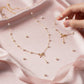 Parure Nœud Ruban & Perles – Collier & Bracelet Acier Inoxydable Doré